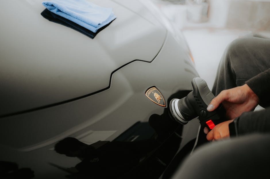 Luxury car receiving premium ceramic coating and auto detailing services
